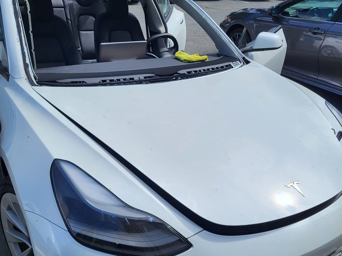 Cracked windshield on a Tesla Model 3 before repair